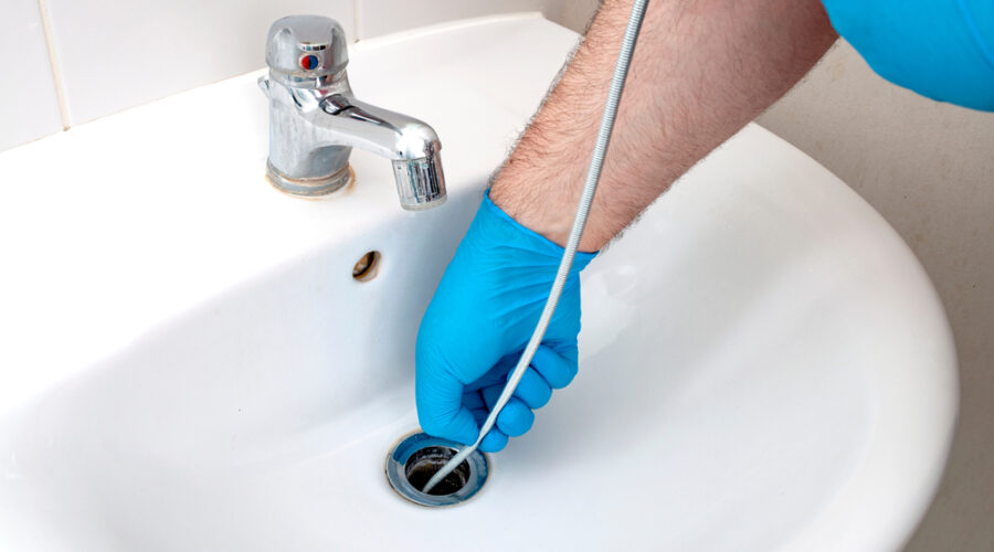 Clearing Clogged Drains with a Plumbing Snake