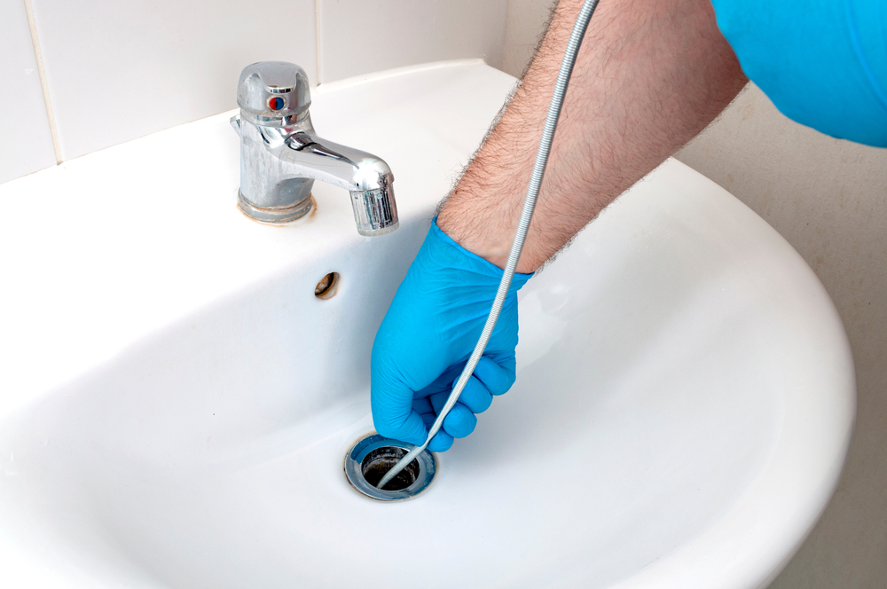 Clearing Clogged Drains with a Plumbing Snake