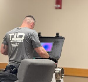 TID Trenchless technician operating sewer camera inspection equipment in Southeastern Massachusetts