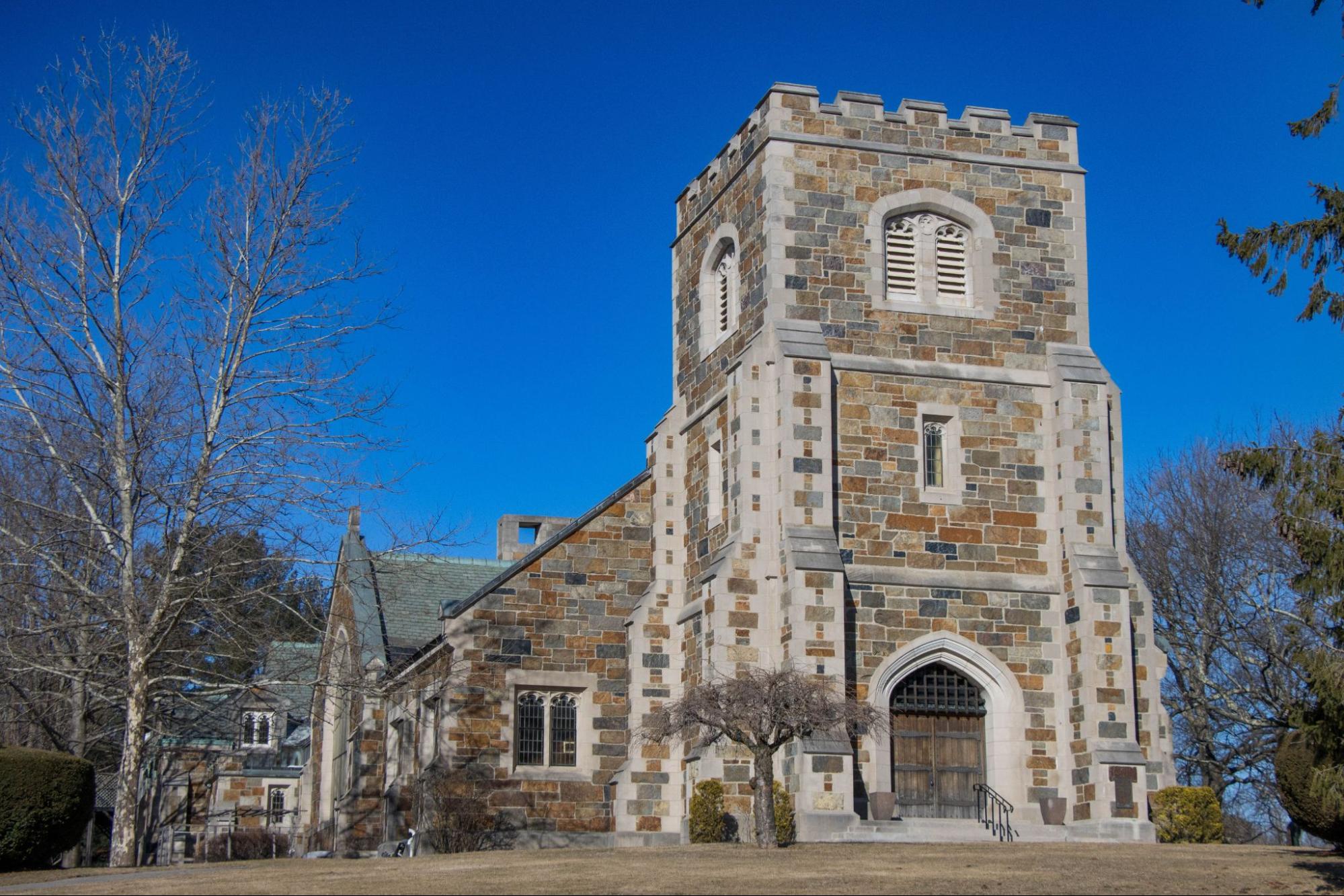 Historic stone church in a Newton, MA village, part of the area served by TID Trenchless.