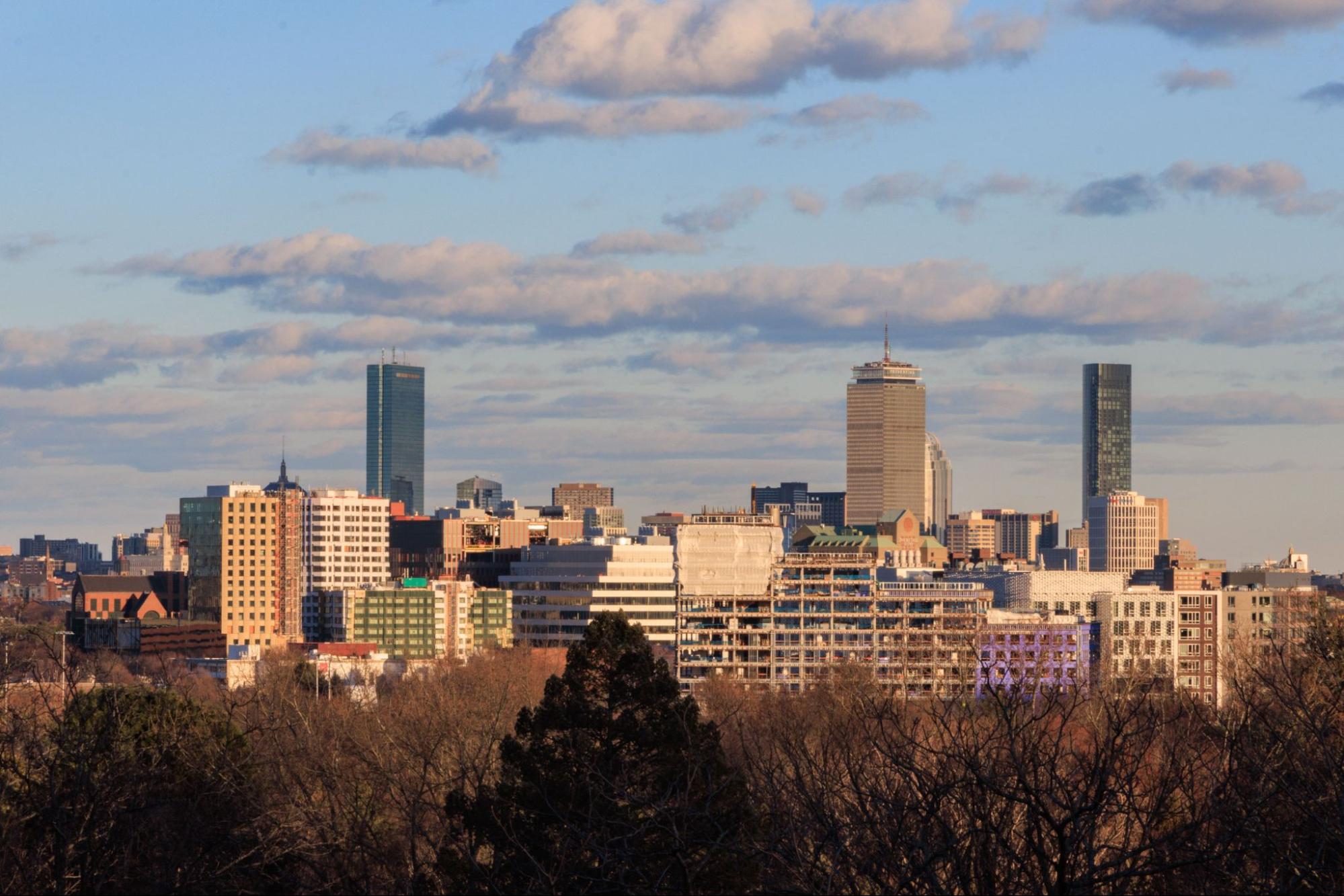 Boston skyline seen from Cambridge, MA, where TID Trenchless provides sewer pipe lining.